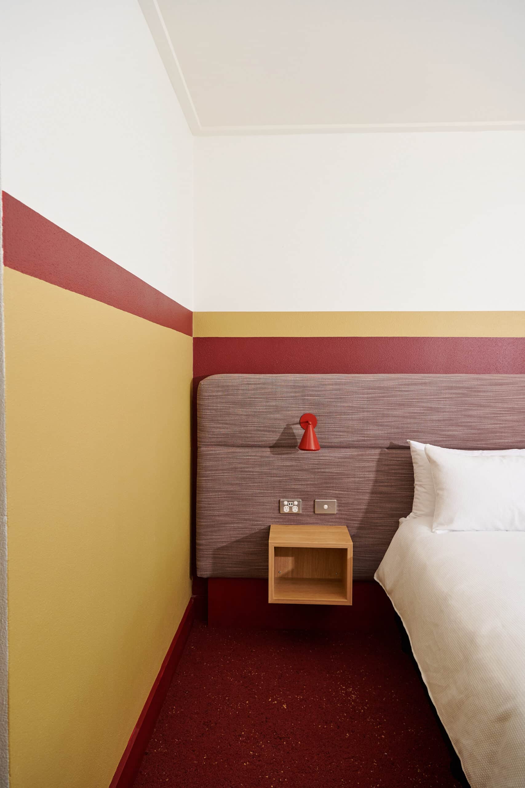 Bed side table and bed in Upper House Queen Room